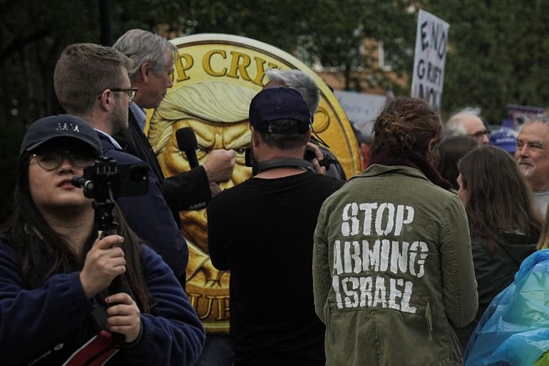 Demonstrators gather outside Trump National Golf Course ahead of U.S. President Donald Trump’s meme coin gala in Sterling, Virginia, U.S., May 22, 2025. 