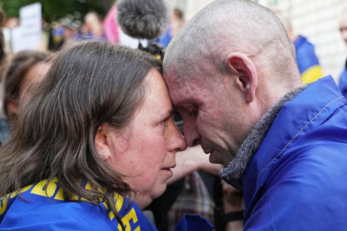 A Ukrainian serviceman Alexander, 45, hugs his wife Elena, 39, after returning from captivity during a POWs exchange between Russia and Ukraine, in Chernyhiv region, Ukraine
